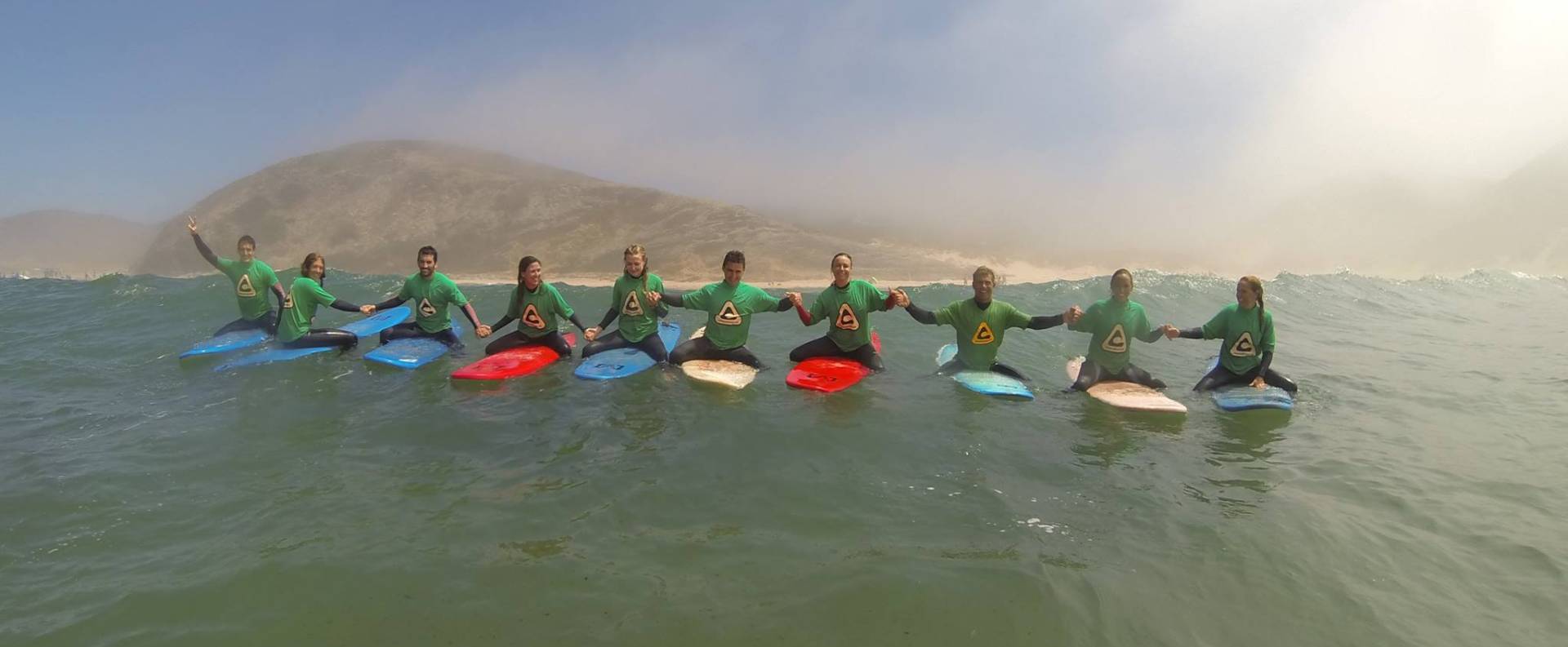 Welcome to the Sagres Surfcamp! Holding hands while waiting for the next wave!